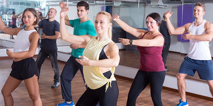 group of six people doing barre