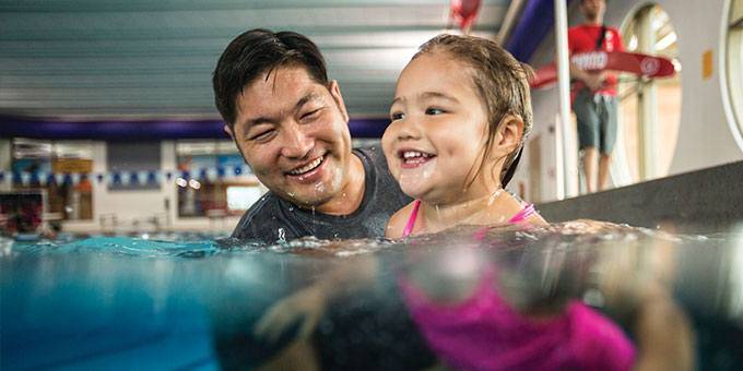 Parent and Child learning to swim