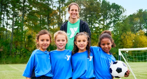 Sports coach with team