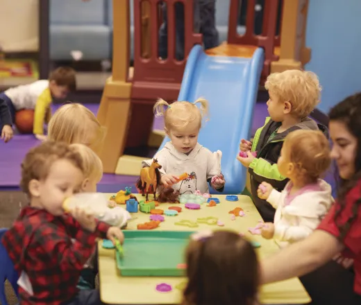Kids playing at table.