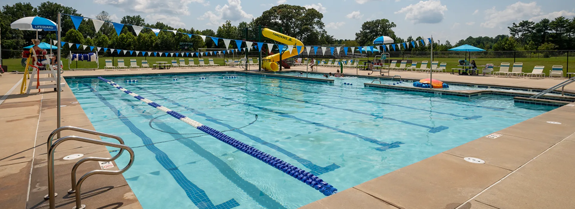 Outdoor pool with lap lanes and slide