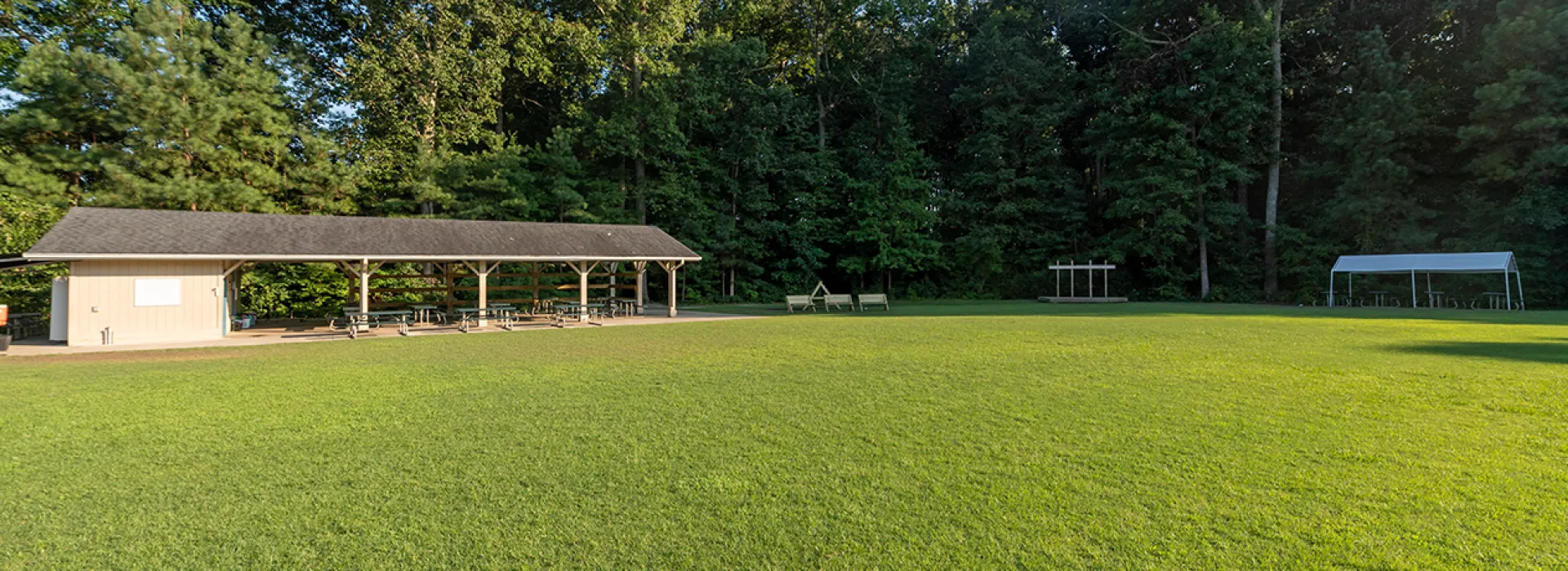 Outside recreation area with field and pavillion